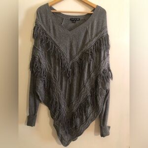 Fringed knit poncho sweater
